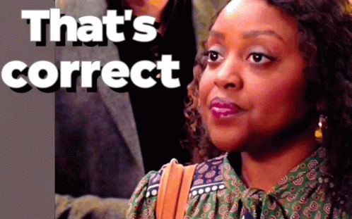 A Woman 'S Face Is Behind A Sign That Says " That 'S Correct " GIF