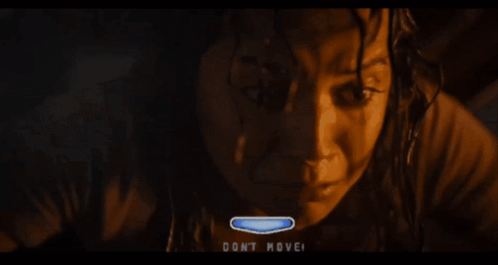 A Woman 'S Face Is Shown With The Words " Do N't Move " On The Bottom Right GIF