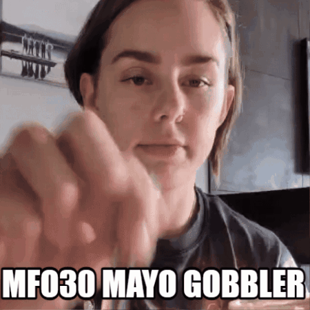 A Woman 'S Face Is Shown With The Words Mf030 Mayo Gobbler Above Her GIF