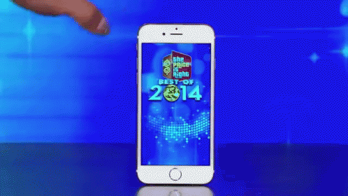 A Woman 'S Hand Is Touching A Cell Phone That Says Best Of 2014 On The Screen GIF