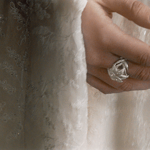 A Woman 'S Hand With A Ring On Her Finger GIF
