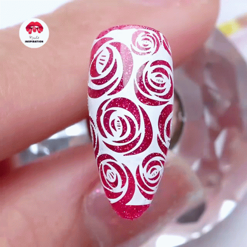 A Woman 'S Nails Are Painted Red And White With Roses And The Words Nails Inspiration On The Bottom Right GIF
