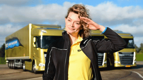 A Woman Salutes In Front Of A Truck That Says ' Daf ' On It GIF