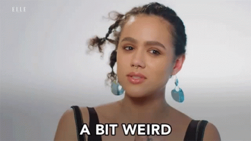A Woman Says A Bit Weird In Front Of Her Face GIF