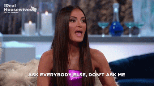 A Woman Says Ask Everybody Else Do N't Ask Me While Sitting On A Couch GIF