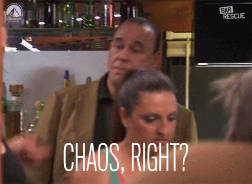 Woman Saying Chaos In Front Of Man In Suit GIF