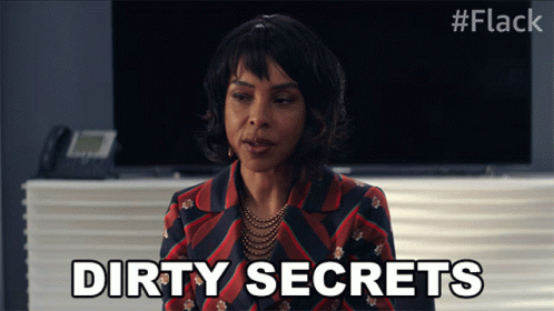 A Woman Says Dirty Secrets In Front Of A Telephone GIF
