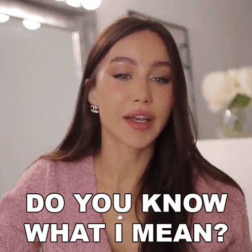A Woman Says Do You Know What I Mean In A Pink Shirt GIF