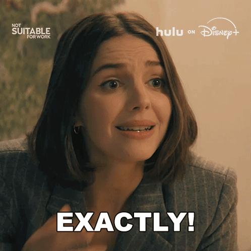 A Woman Says Exactly In Front Of A Sign That Says Now Suitable For Work GIF