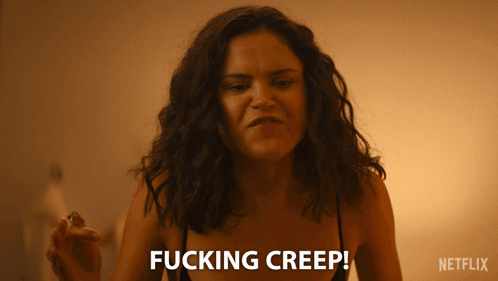 A Woman Says Fucking Creep While Holding A Small Object GIF