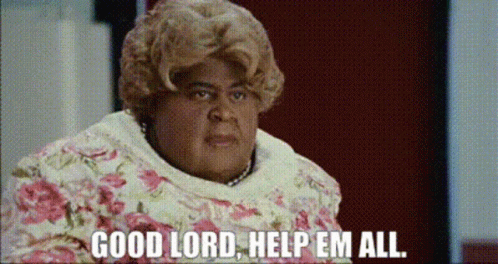 A Woman Says Good Lord Help Em All In A Floral Dress GIF