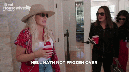 A Woman Says Hell Hath Not Frozen Over While Holding Two Red Cups GIF