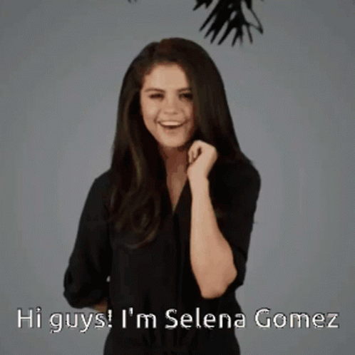A Woman Says Hi Guys I 'M Selena Gomez In A Black Shirt GIF