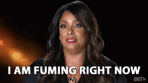 A Woman Says I Am Fuming Right Now In Front Of A Black Background GIF