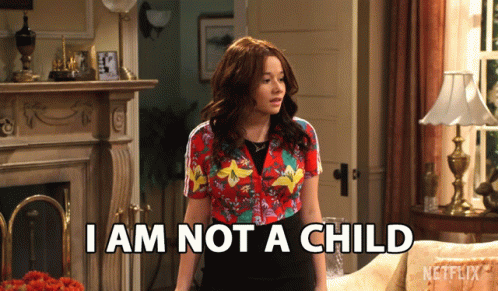 A Woman Says I Am Not A Child While Standing In A Living Room GIF