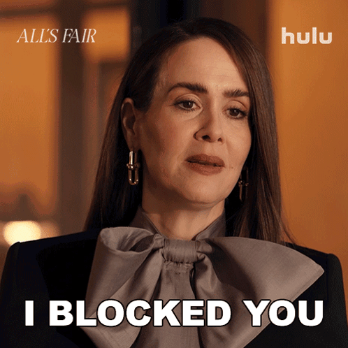 A Woman Says " I Blocked You " In Front Of A Hulu Logo GIF