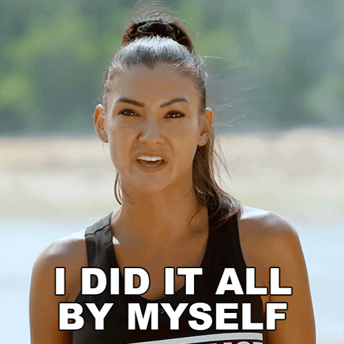 A Woman Says " I Did It All By Myself " In Front Of A Body Of Water GIF