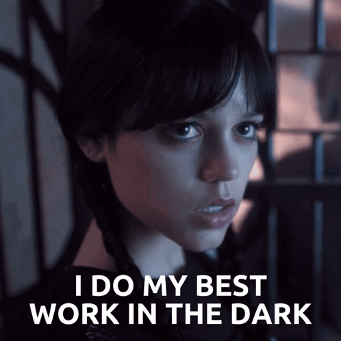 A Woman Says " I Do My Best Work In The Dark " In A Dark Room GIF