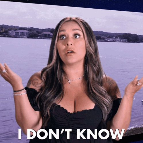 A Woman Says I Don 'T Know In Front Of A Lake GIF