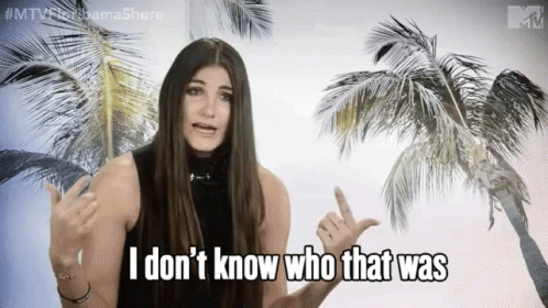 Woman Saying I Don't Know Who That Was In Front Of Palm Trees GIF