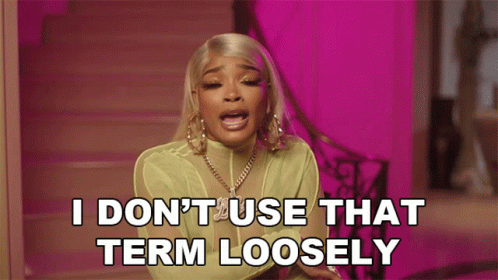 A Woman Says " I Don 'T Use That Term Loosely " In Front Of A Pink Background GIF