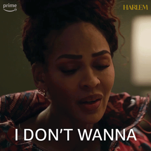 A Woman Says " I Don 'T Wanna " In Front Of A Harlem Sign GIF
