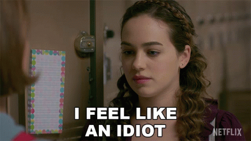 A Woman Says I Feel Like An Idiot In Front Of A Netflix Sign GIF