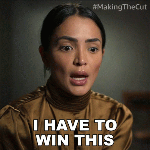 A Woman Says " I Have To Win This " While Wearing A Brown Shirt GIF