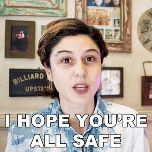 A Woman Says I Hope You 'Re All Safe In Front Of A Billiard Sign GIF