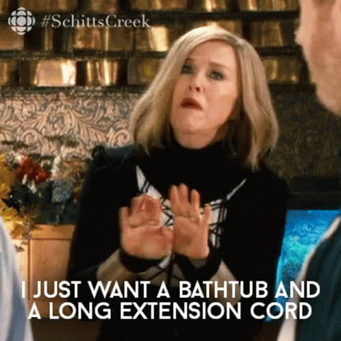 A Woman Says " I Just Want A Bathtub And A Long Extension Cord " In A Scene From Schitts Creek GIF