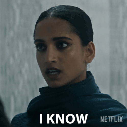A Woman Says I Know In Front Of A Netflix Sign GIF