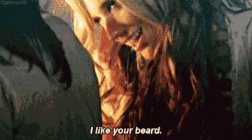 a woman says i like your beard in a pixelated image