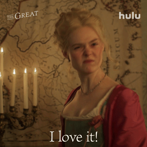 A Woman Says " I Love It " In Front Of A Map And Candles GIF