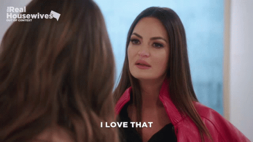 A Woman Says I Love That While Looking At Herself In The Mirror GIF