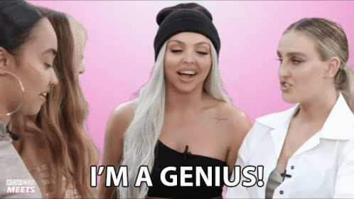 a woman says " i 'm a genius " while standing next to two other women