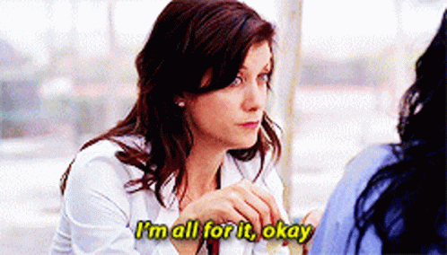 Woman Saying Im All For It Okay At Table GIF