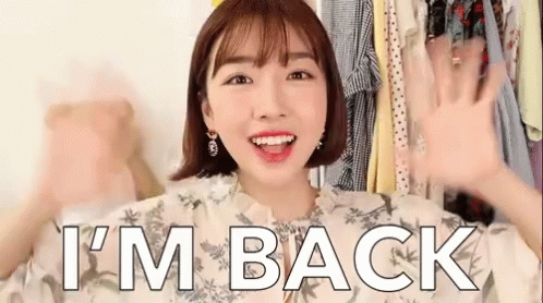 A Woman Says I 'M Back In Front Of A Closet Of Clothes GIF