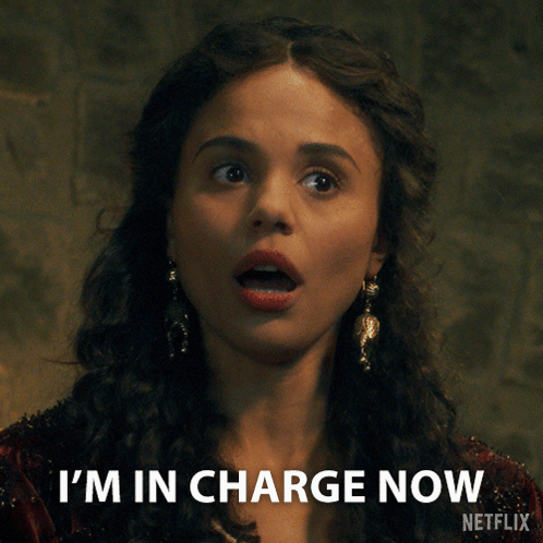 A Woman Says I 'M In Charge Now With A Netflix Logo Behind Her GIF
