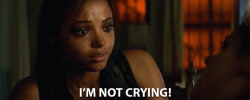 A Woman Says " I 'M Not Crying " In Front Of A Window GIF