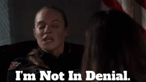 A Woman Says " I 'M Not In Denial " In Front Of Another Woman GIF