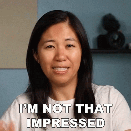 A Woman Says " I 'M Not That Impressed " While Smiling GIF