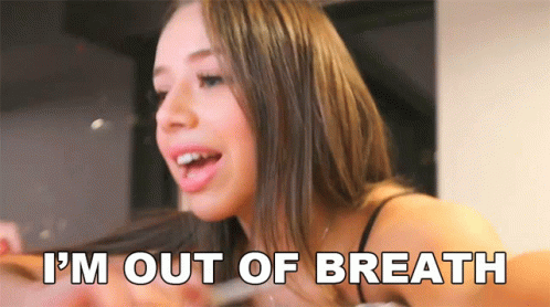 A Woman Says " I 'M Out Of Breath " In Front Of Her Face GIF