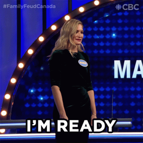 A Woman Says I 'M Ready While Standing In Front Of A Podium GIF