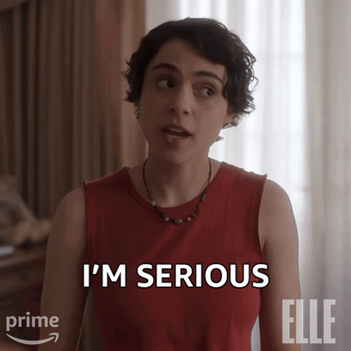 A Woman Says I 'M Serious In A Red Shirt GIF