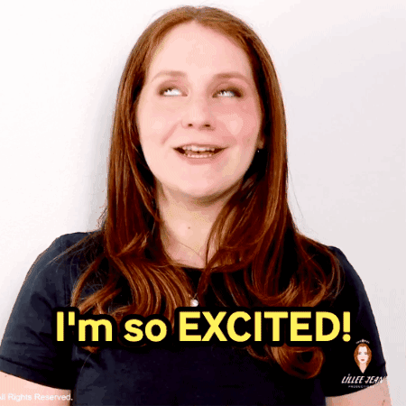 A Woman Says I 'M So Excited In Front Of A White Background GIF