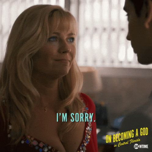A Woman Says I 'M Sorry In Front Of A Man GIF