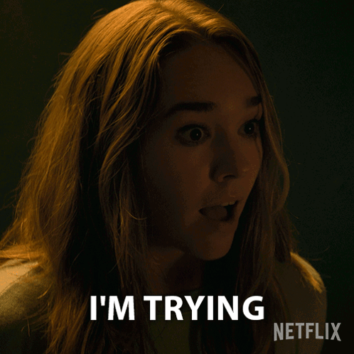 A Woman Says I 'M Trying In A Dark Room GIF