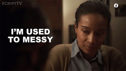 A Woman Says " I 'M Used To Messy " While Looking Down At Something GIF