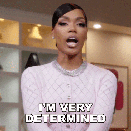 A Woman Says I 'M Very Determined In A Pink Sweater GIF