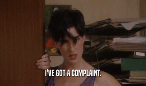 A Woman Says I 'Ve Got A Complaint While Standing In Front Of A Door GIF